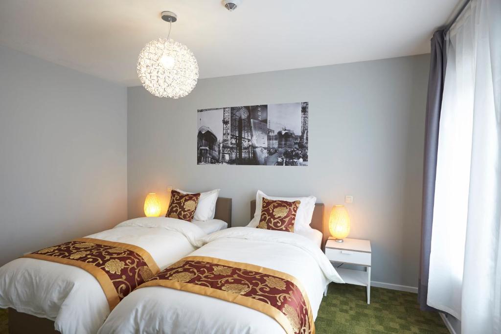 deluxe hotel suite bedroom with king bed, modern furniture, city view, elegant lighting