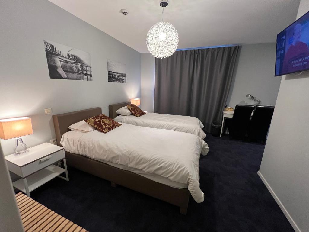 deluxe hotel suite bedroom with king bed, modern furniture, city view, elegant lighting