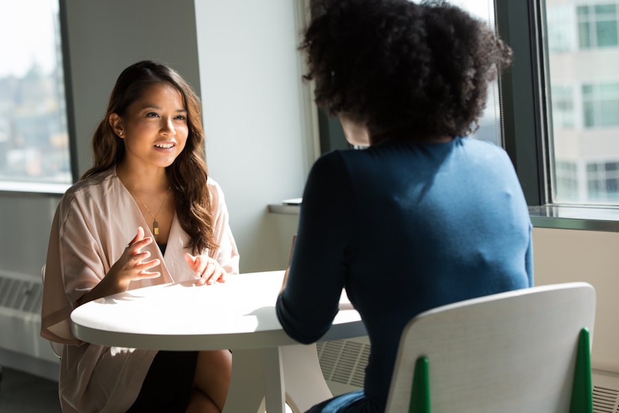 Counsellor speaking warmly with a client during a therapy session